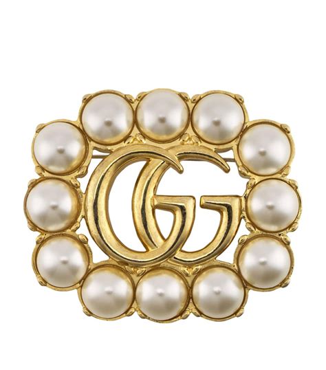 what does the double g in gucci mean|Gucci Double G brooch.